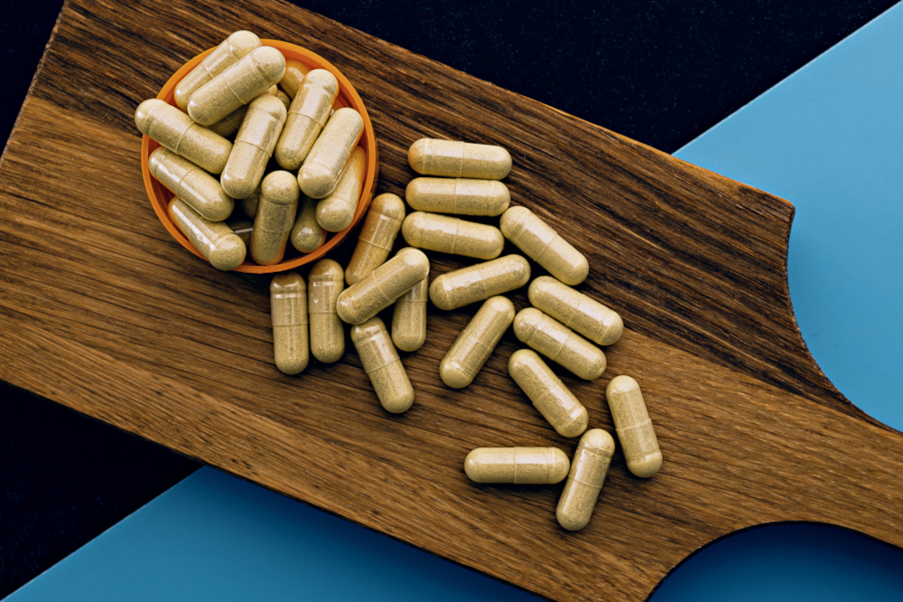 Hard capsules on wooden board
