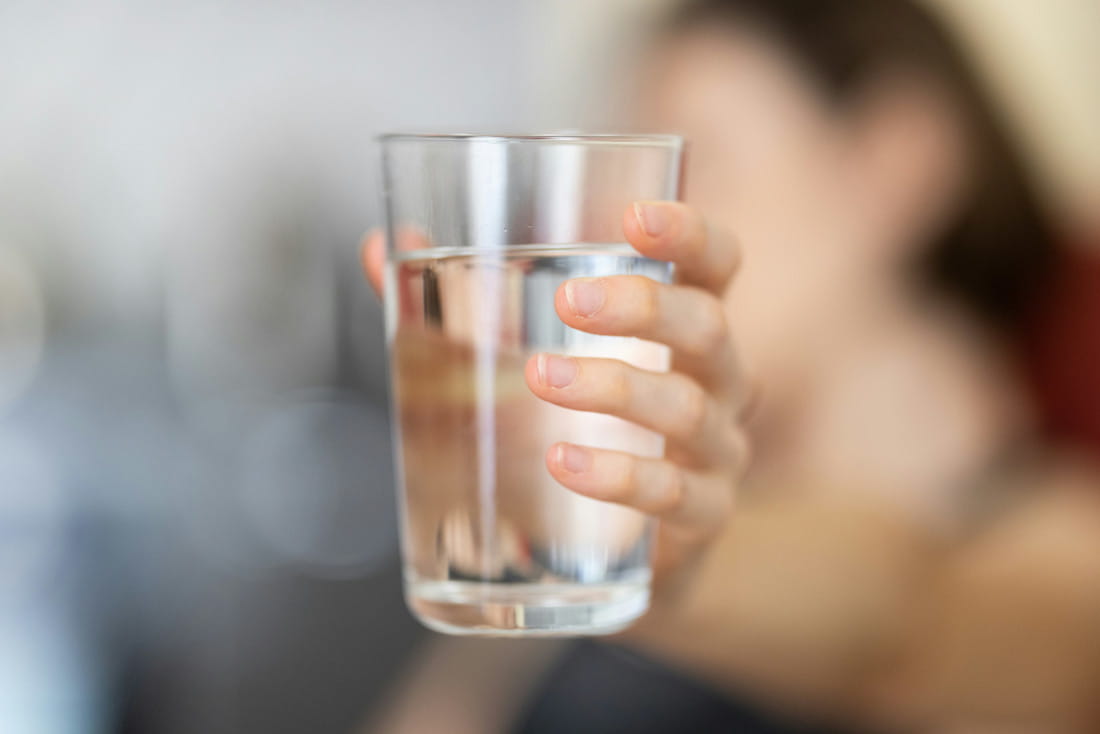 Glass of water held up to the camera